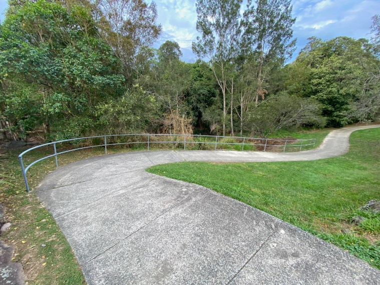 A path in a park AI-generated content may be incorrect.