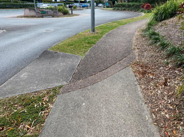 A sidewalk next to a street AI-generated content may be incorrect.