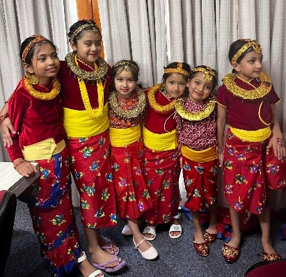 A group of Nepali girls wearing colorful dresses