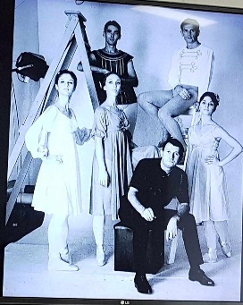 A group of people posing for a photo AI-generated content may be incorrect.