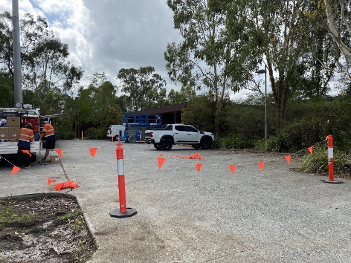 A group of people standing in a parking lot AI-generated content may be incorrect.